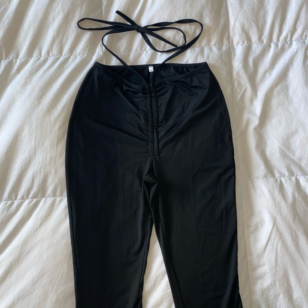 Flattering black flare pants with waist tie